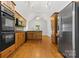 Kitchen with wood cabinets, granite countertops, and stainless steel appliances at 4823 Morris Glen Dr, Concord, NC 28027
