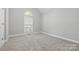 Well-lit bedroom with carpet flooring and arched window at 4823 Morris Glen Dr, Concord, NC 28027