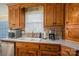 Kitchen features double sink, wood cabinets, and modern appliances at 2620 Tralee Dr, Gastonia, NC 28056