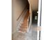 Unfinished wooden staircase with black metal railing in an entryway at 4057 Port Richmond Ave # 13, Gastonia, NC 28056