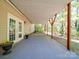 Covered patio with French doors leading to the backyard at 606 W Queens Dr, Dallas, NC 28034