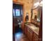 Elegant bathroom with granite countertops, decorative mirror, and patterned tile floor at 377 Riverwood Rd, Mooresville, NC 28117