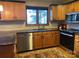 Kitchen boasts granite countertops, stainless steel appliances, and ample cabinetry at 377 Riverwood Rd, Mooresville, NC 28117