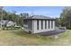 Modern concrete garage with black metal roof and large glass doors at 248 Singleton Rd # 25, Mooresville, NC 28117