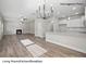 Open living room and kitchen with hardwood floors and a fireplace at 209 Lake George Dr, Shelby, NC 28152