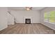 Living room with fireplace and vinyl flooring at 202 Lake George Dr, Shelby, NC 28152