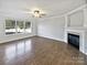 Spacious living room with hardwood floors and a fireplace at 8117 Aqueduct Ct, Charlotte, NC 28216