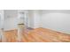 Hardwood floor dining area with kitchen and hallway access at 1036 N Center St, Hickory, NC 28601