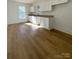 Bright kitchen features white cabinets, granite countertops, and light wood flooring at 112 Maple St, Shelby, NC 28150