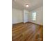 Spacious bedroom with hardwood floors, large window, and closet at 112 Maple St, Shelby, NC 28150