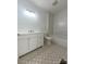 Modern bathroom with white subway tile, patterned floor, and updated vanity at 112 Maple St, Shelby, NC 28150