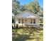 Newly renovated home with a front porch and lush lawn at 112 Maple St, Shelby, NC 28150