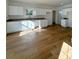 Bright kitchen features white cabinets, granite countertops, and light wood flooring at 112 Maple St, Shelby, NC 28150