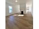 Bright living room with hardwood floors and fireplace at 112 Maple St, Shelby, NC 28150