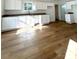Bright kitchen features white cabinets, granite countertops, and light wood flooring at 112 Maple St, Shelby, NC 28150