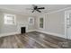Bright living room with hardwood floors and ceiling fan at 807 Klondale Ave, Kannapolis, NC 28081