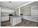 Open kitchen featuring white cabinets, gray countertops, and an island at 807 Klondale Ave, Kannapolis, NC 28081