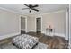 Living area with hardwood floors, ceiling fan, and built-in shelving at 807 Klondale Ave, Kannapolis, NC 28081