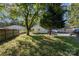 Large backyard with trees and a wooden fence at 807 Klondale Ave, Kannapolis, NC 28081