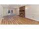 Living room with hardwood floors and fireplace, access to deck at 8519 Middleton Cir, Harrisburg, NC 28075