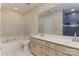 Bathroom with double sinks, beige cabinets, and a walk-in shower at 8519 Middleton Cir, Harrisburg, NC 28075