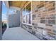 Covered porch with stone exterior and a view of the neighborhood at 5234 Verona Rd # 79, Charlotte, NC 28213