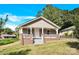 Tan house with a front porch and steps leading to the entrance at 401 Ford St, Kannapolis, NC 28083