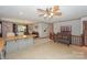 Open concept kitchen with island and views to the dining room at 459 Kenway Loop, Mooresville, NC 28117