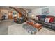Finished basement with comfy seating and a view of the staircase at 459 Kenway Loop, Mooresville, NC 28117