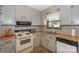 Kitchen area with white appliances and wood countertops at 459 Kenway Loop, Mooresville, NC 28117