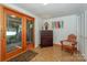 Bright basement area showcasing lake views through French doors and a dresser at 459 Kenway Loop, Mooresville, NC 28117