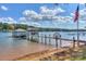 Extended lake dock with a covered gazebo and sandy shoreline at 459 Kenway Loop, Mooresville, NC 28117