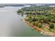 Aerial view of lakefront property with a pier and large yard at 459 Kenway Loop, Mooresville, NC 28117
