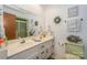Double vanity bathroom with updated fixtures and decor at 459 Kenway Loop, Mooresville, NC 28117
