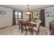 Bright dining room with a wood table and lake views at 459 Kenway Loop, Mooresville, NC 28117