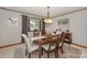 Dining room with wood table and chairs, and lake view at 459 Kenway Loop, Mooresville, NC 28117