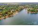 Aerial view showcasing a lakefront property with lush green surroundings at 459 Kenway Loop, Mooresville, NC 28117