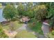 Aerial view of lakefront home with detached garage and large yard at 459 Kenway Loop, Mooresville, NC 28117
