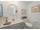 Clean basement bathroom, featuring a vanity with a marble countertop at 459 Kenway Loop, Mooresville, NC 28117