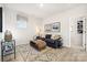 Spacious bonus room with a sofa and plenty of natural light at 1406 Hubert Graham Way, Tega Cay, SC 29708