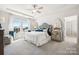 Main bedroom with a king-size bed and ensuite bathroom at 1406 Hubert Graham Way, Tega Cay, SC 29708