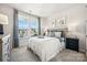 Bright bedroom with large windows and neutral decor at 1406 Hubert Graham Way, Tega Cay, SC 29708