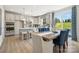 Modern kitchen with island, stainless steel appliances, and eating area at 1406 Hubert Graham Way, Tega Cay, SC 29708