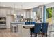 Modern kitchen with island, stainless steel appliances, and eat-in area at 1406 Hubert Graham Way, Tega Cay, SC 29708