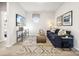 Bright bonus room features a comfy sofa, large TV, and stylish decor at 1406 Hubert Graham Way, Tega Cay, SC 29708