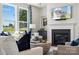 Spacious living room featuring a fireplace and large windows at 1406 Hubert Graham Way, Tega Cay, SC 29708