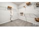 Large walk-in closet with ample shelving and hanging space at 1406 Hubert Graham Way, Tega Cay, SC 29708