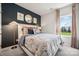Cozy bedroom with a floral comforter and plenty of natural light at 1406 Hubert Graham Way, Tega Cay, SC 29708