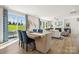 Dining area with sliding glass doors leading to the backyard at 1406 Hubert Graham Way, Tega Cay, SC 29708