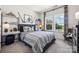 Themed bedroom with hockey decor and built-in shelving at 1406 Hubert Graham Way, Tega Cay, SC 29708